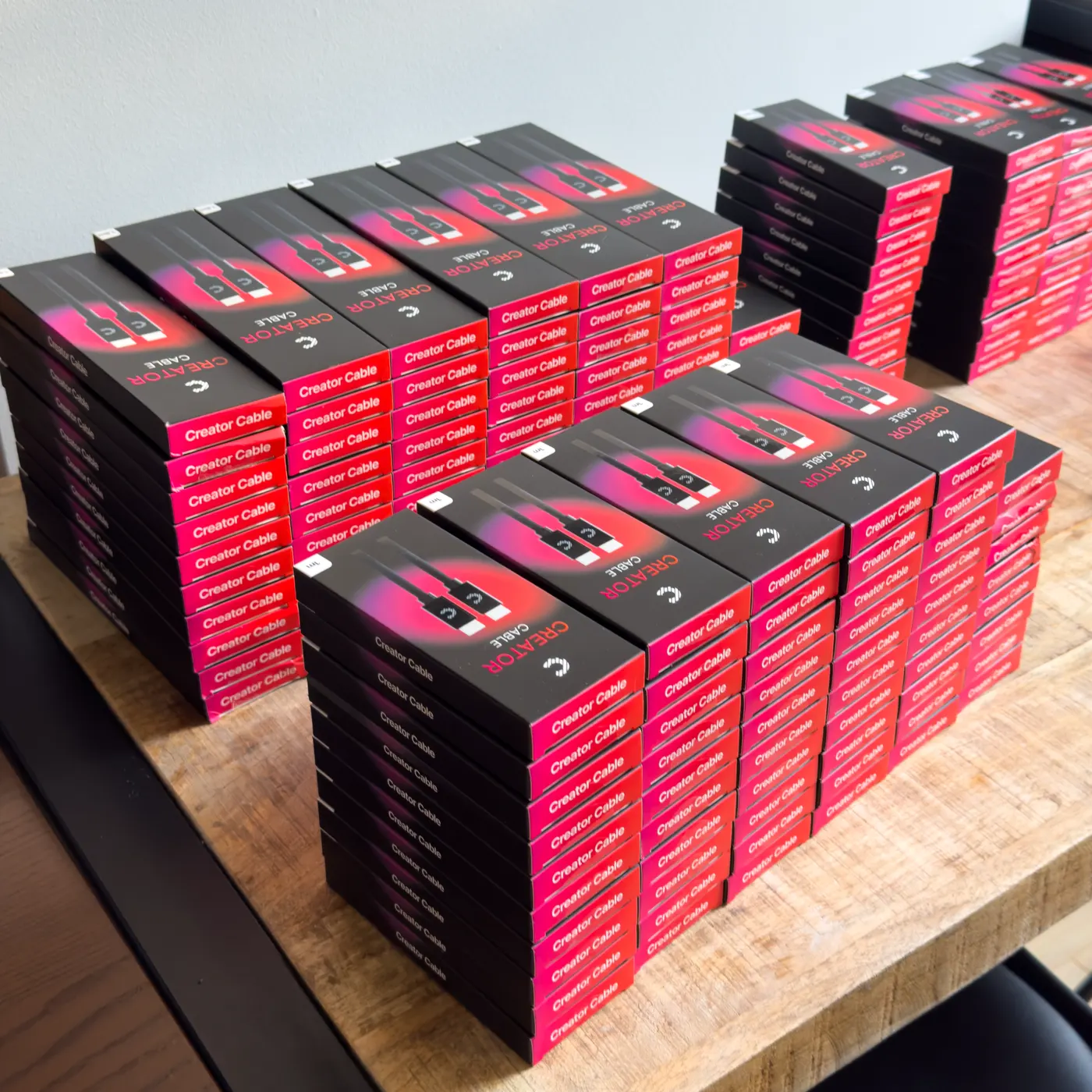 Stacks of Creator Cable boxes on a table